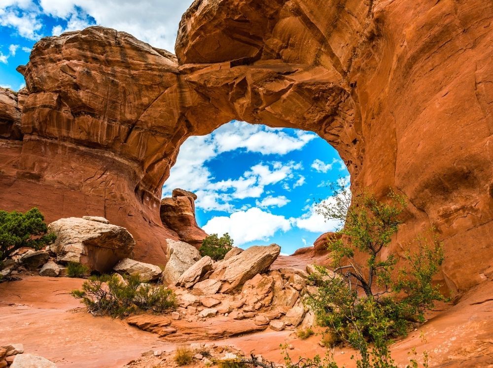 The view through Broken Arch during your Arches National Park itinerary.