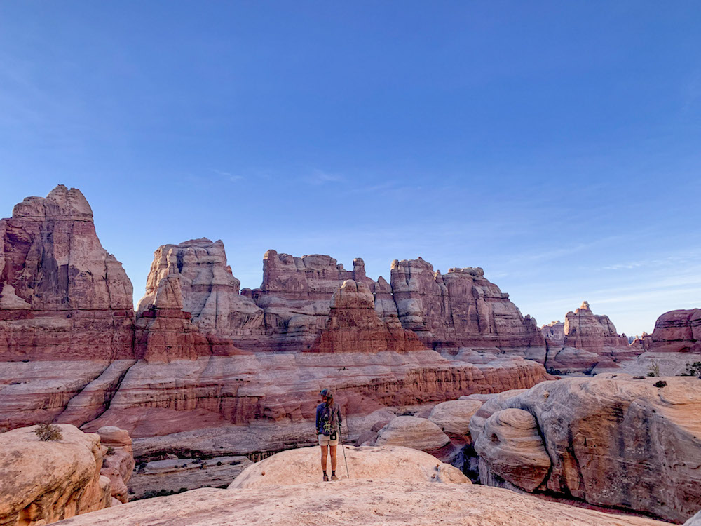 A hiker admiring the views in the Needles, Canyonlands National Park.
