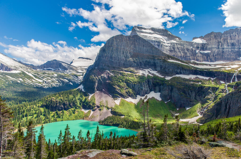 Landscape view of Glacier National Park and the turquoise lake in one of the best national parks for hiking. 