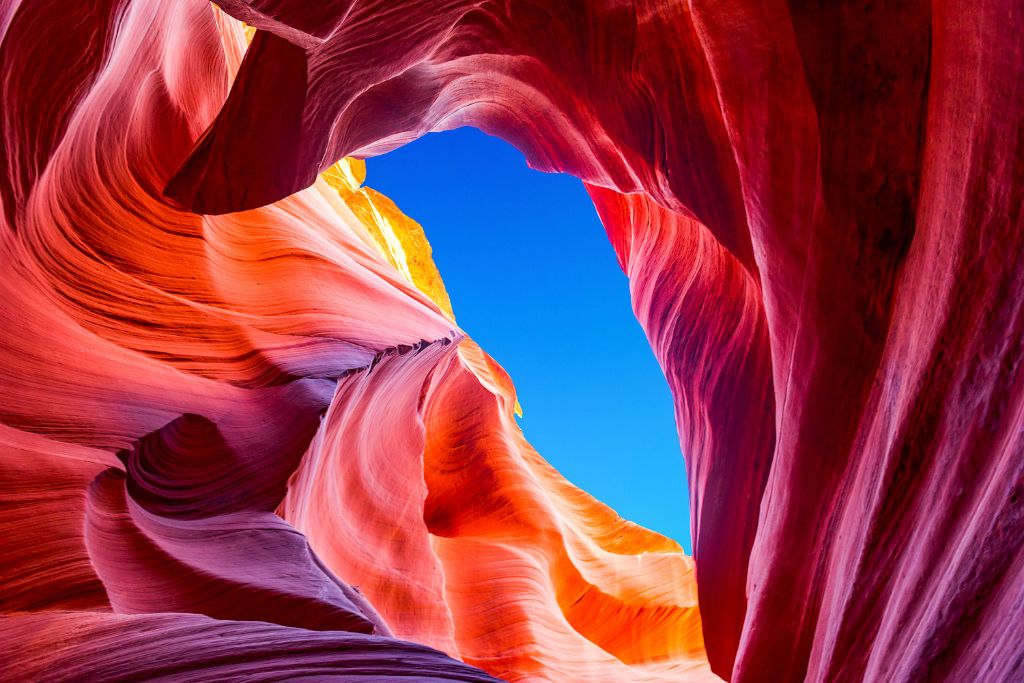 Otherworldly feel of the rocks at Antelope Canyon during your drive from Denver to the Grand Canyon.