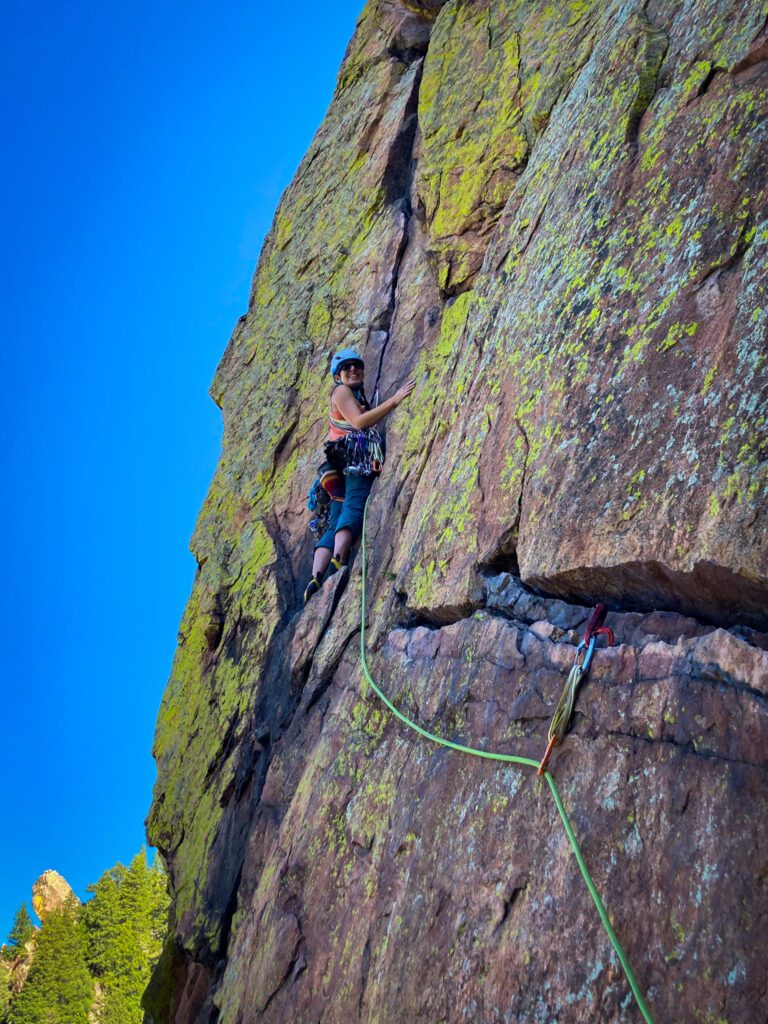 Rock climber tackling rocks near Boulder. 