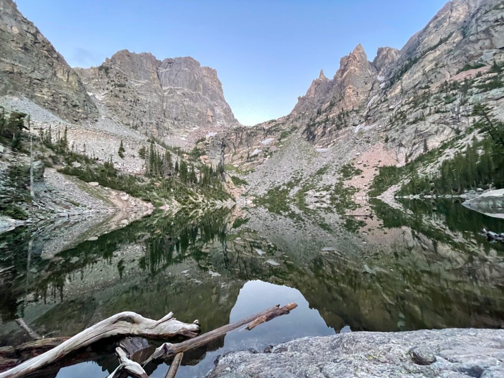 A view of a stunning alpine lake nestled inside Rocky Mountain National park. 
