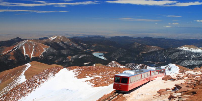 View of Pikes Peak and Manitou Springs Train on the top of Pikes Peak Mountain, Colorado, USA