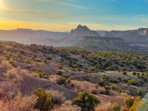 A view of the desert landscape on a bright and sunny day at sunset at Baptist Draw.
