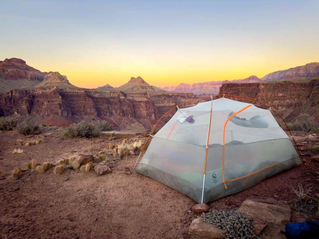A tent at sunset overlooking the Grand CAnyon
