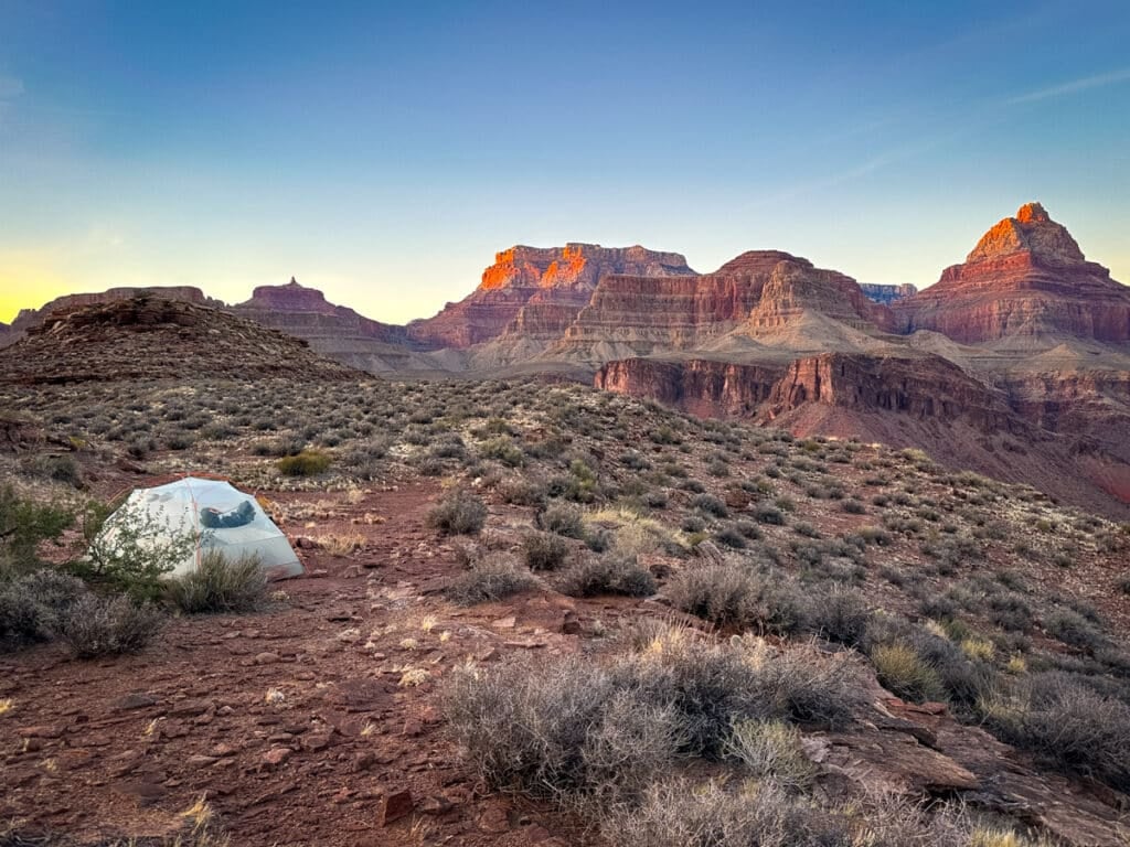 a tent at sunset in the grand canyon along the Tonto Trail on the Escalante Route