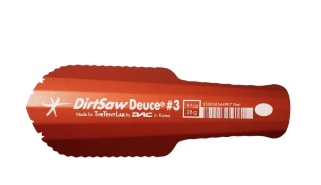 a lightweight metal trowel used for digging cat holes